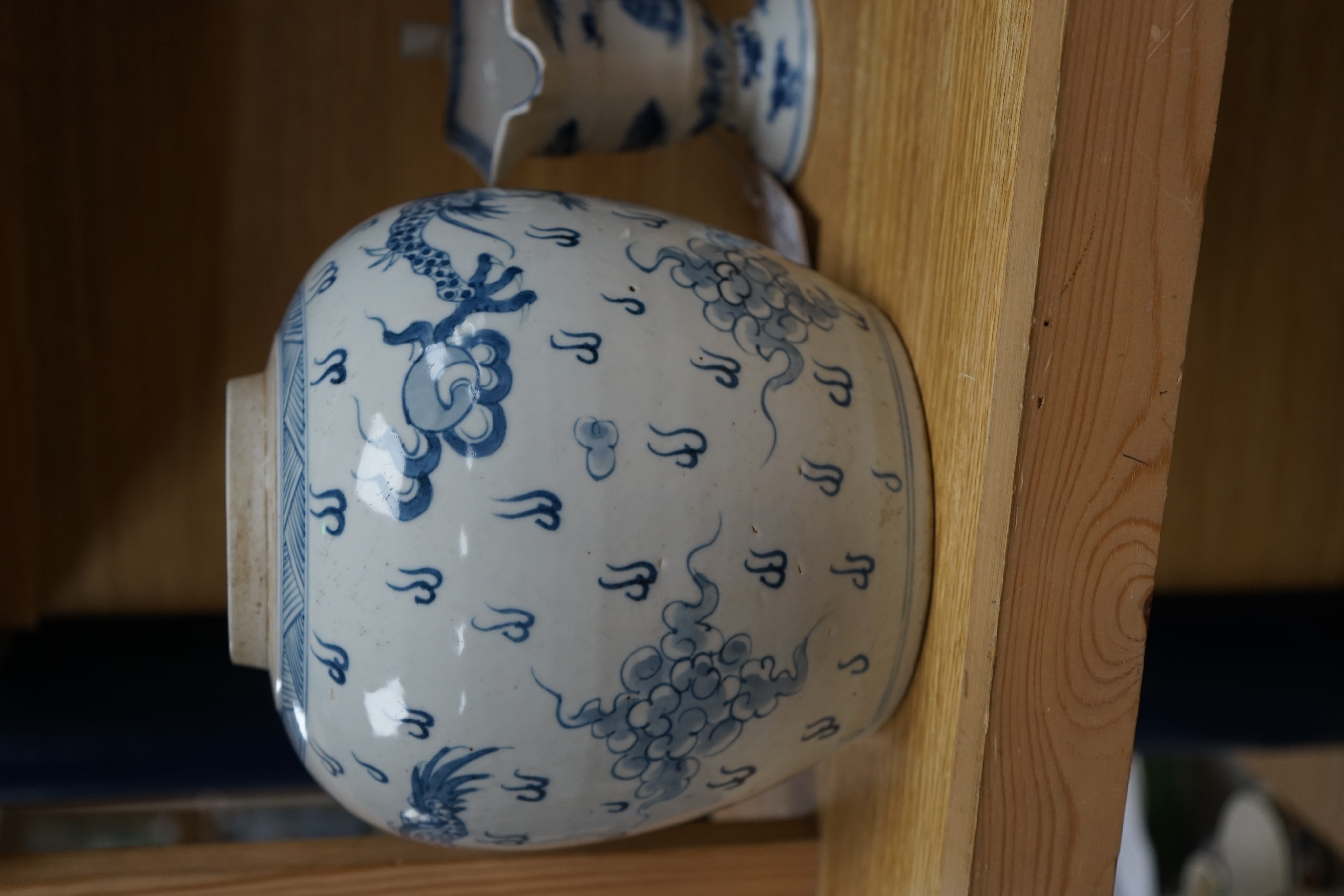 A Chinese blue and white jar, 20cm and a helmet shaped jug, 18th century and later